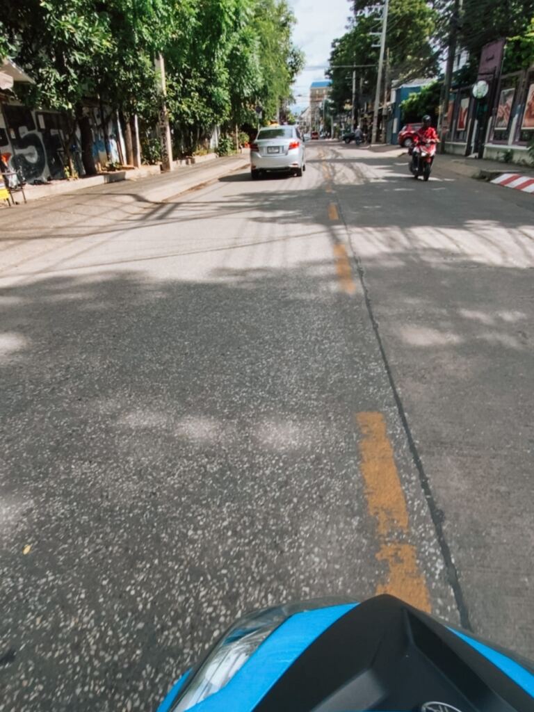 riding a scooter in the streets of Chiang Mai