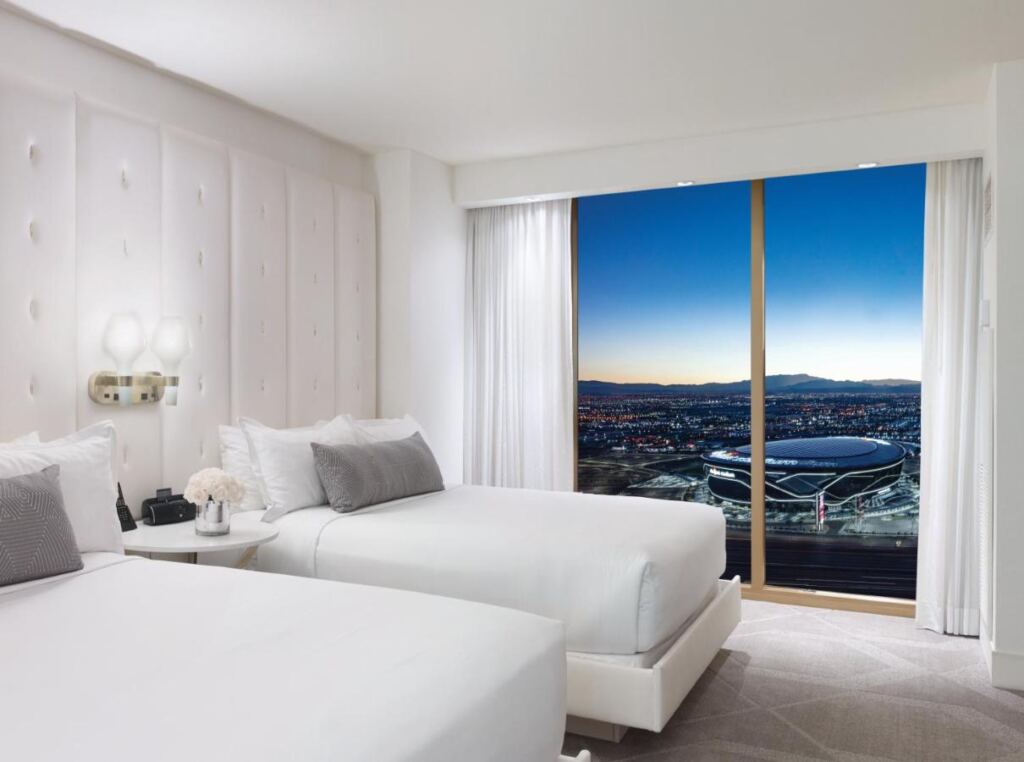 One of the bedrooms of Delano Las Vegas at Mandalay Bay with city view.