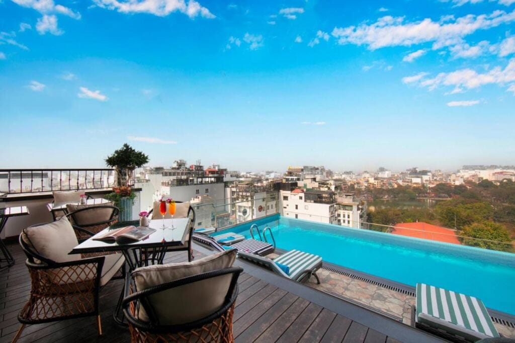 Outdoor swimming pool with scenic view in The Oriental Jade Hotel .
