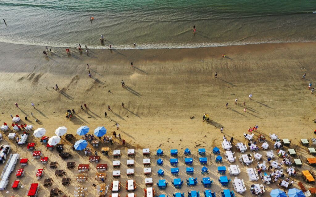 Jimbaran Fish Market Beach dinner as seen from the air with dinner tables and umbrellas