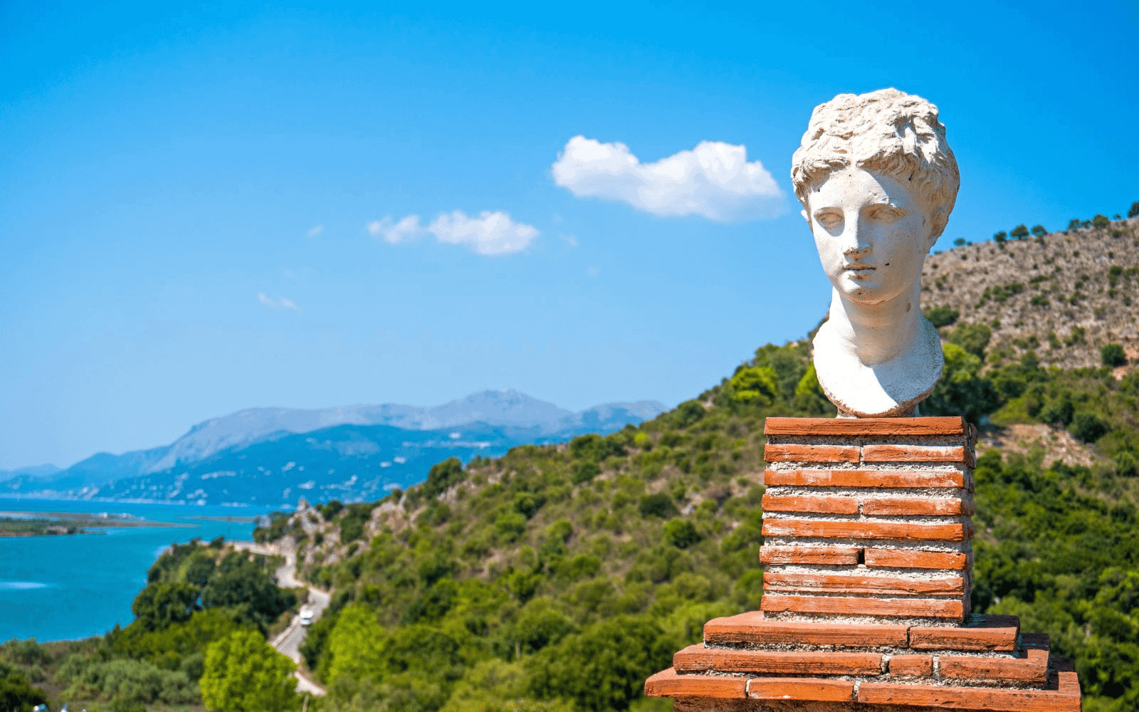 Greek Statue and mountain and see view from Butrint National Park in South Albania