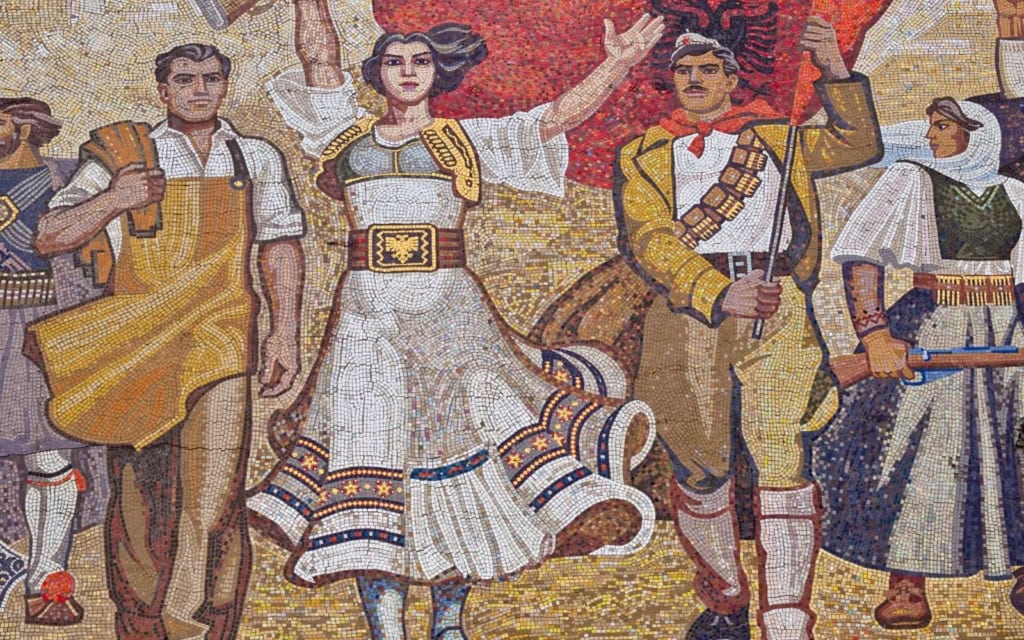 Famous mosaic of Albanians in traditional dress on the National Historical Museum in Tirana