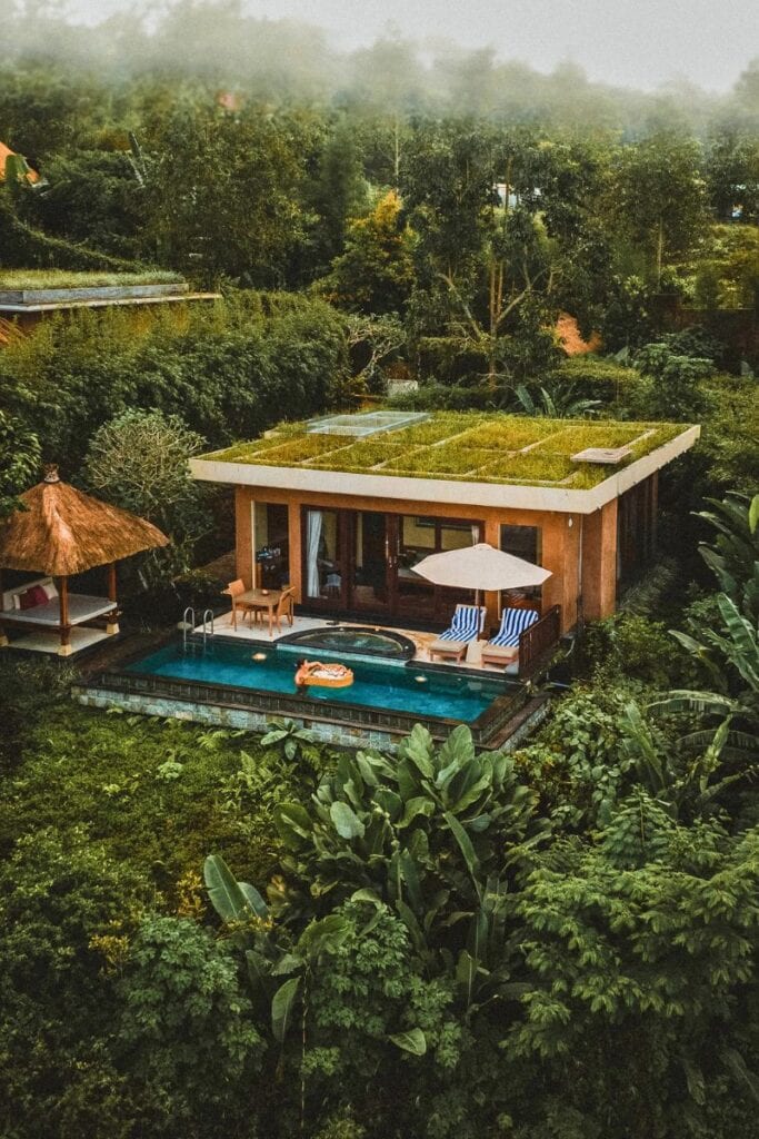 Bali villa with private pool surrounded by tropical jungle scenery.