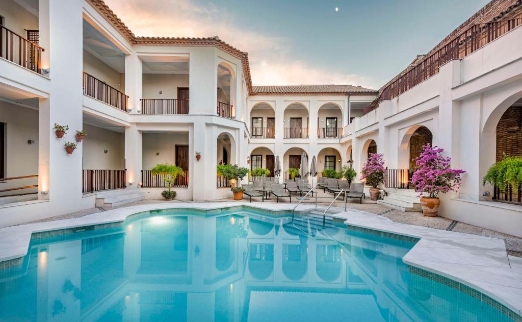 elegant outdoor pool and exterior view of the hotel