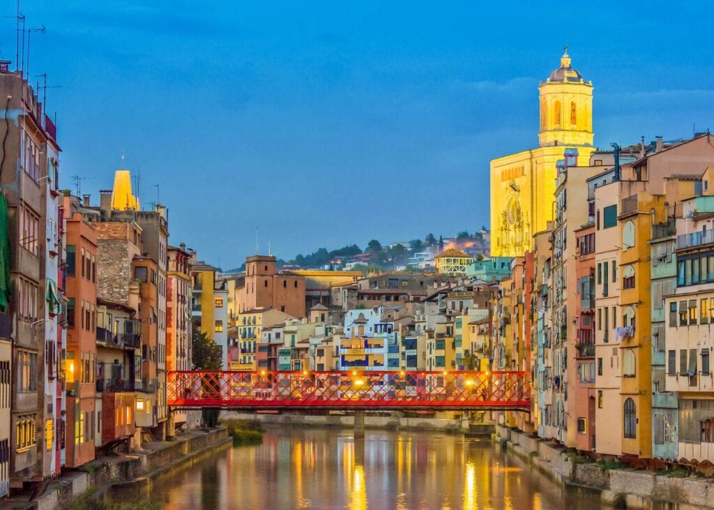 photo of Girona and Eifel Bridge old town at night