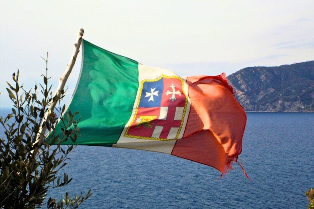 Flag flying over bay in Cinque terre