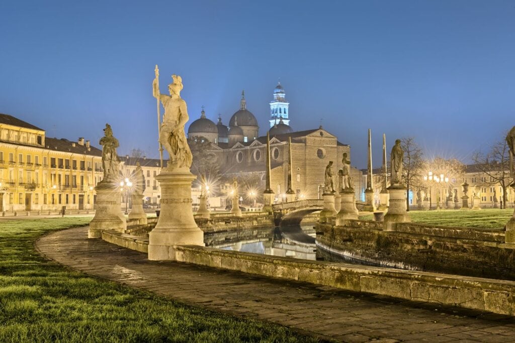 The Prato in Padua at night under street lights