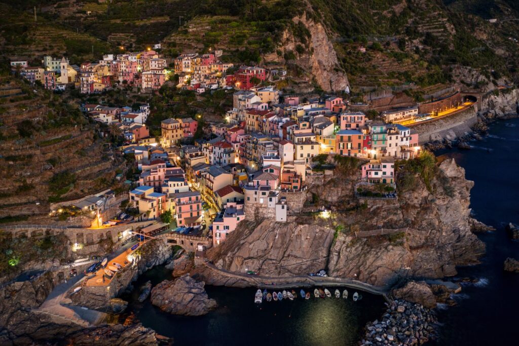 drone shot of manarola at sunset