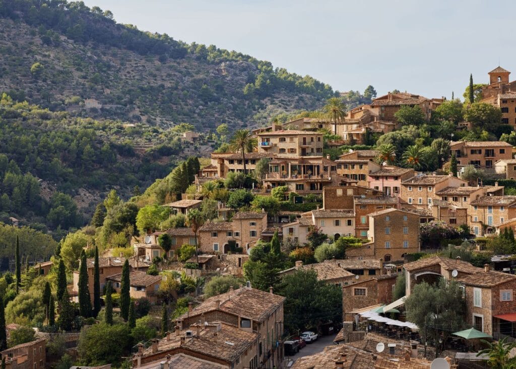 aerial view of old buildings and houses on the hills at Deia, Mallorca Spain
