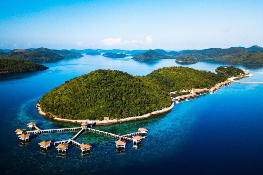 aerial view of private water cottages on an island