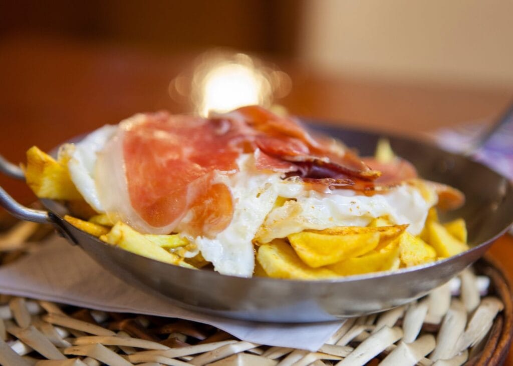 traditional huevos rotos on a plate