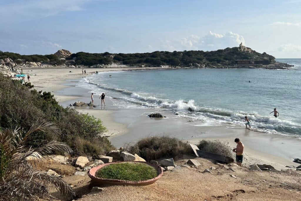 panoramic view of Punta Molentis Beach with visitors enjoying the beach