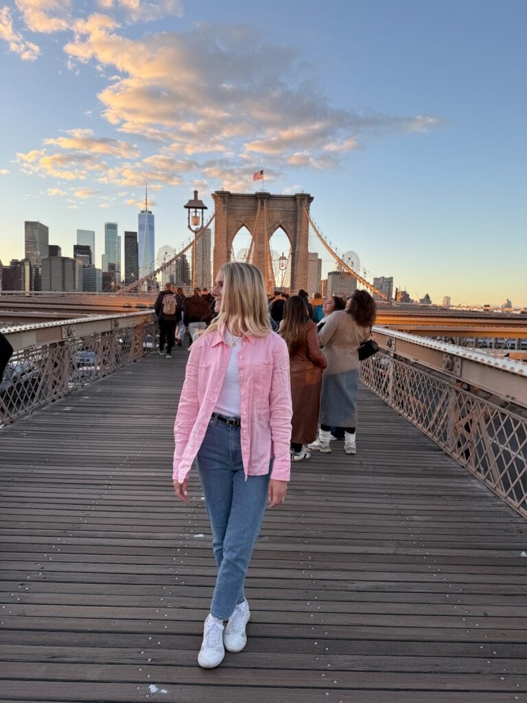 Walking the Brooklyn Bridge in NYC at sunset