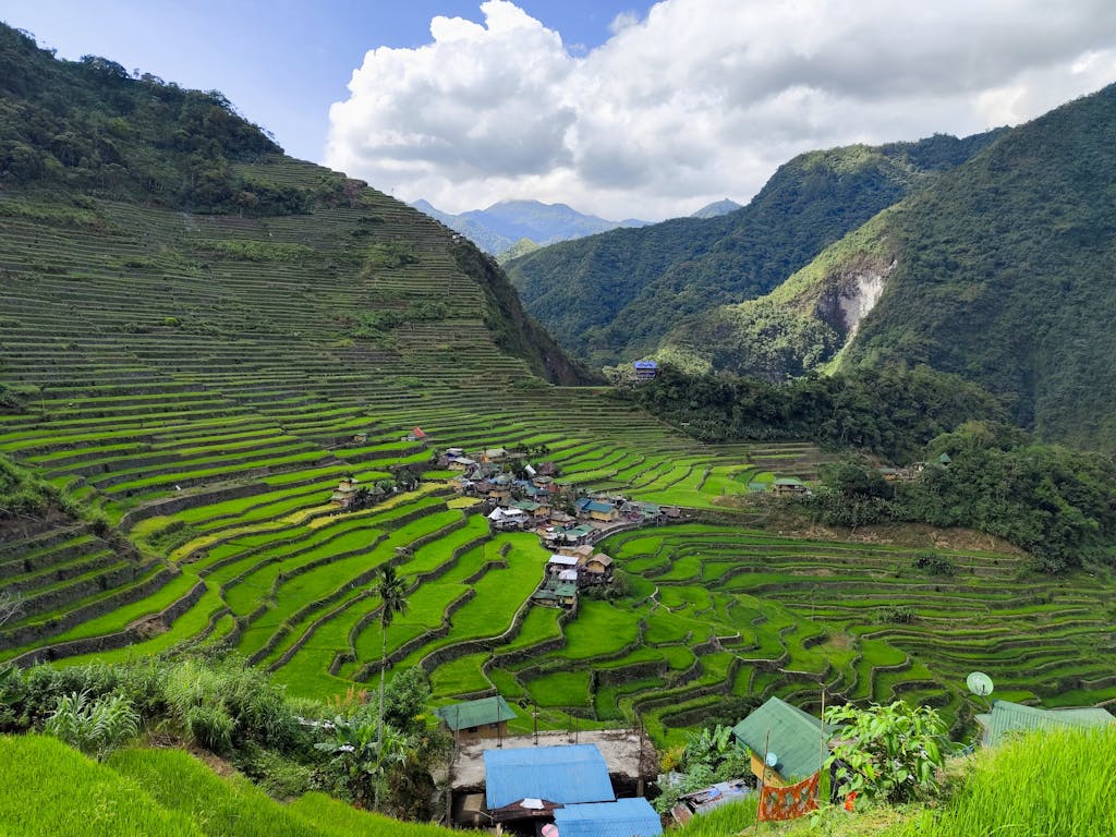 Stunning aerial view of Banaue Rice Terraces in lush green landscape, Philippines.
