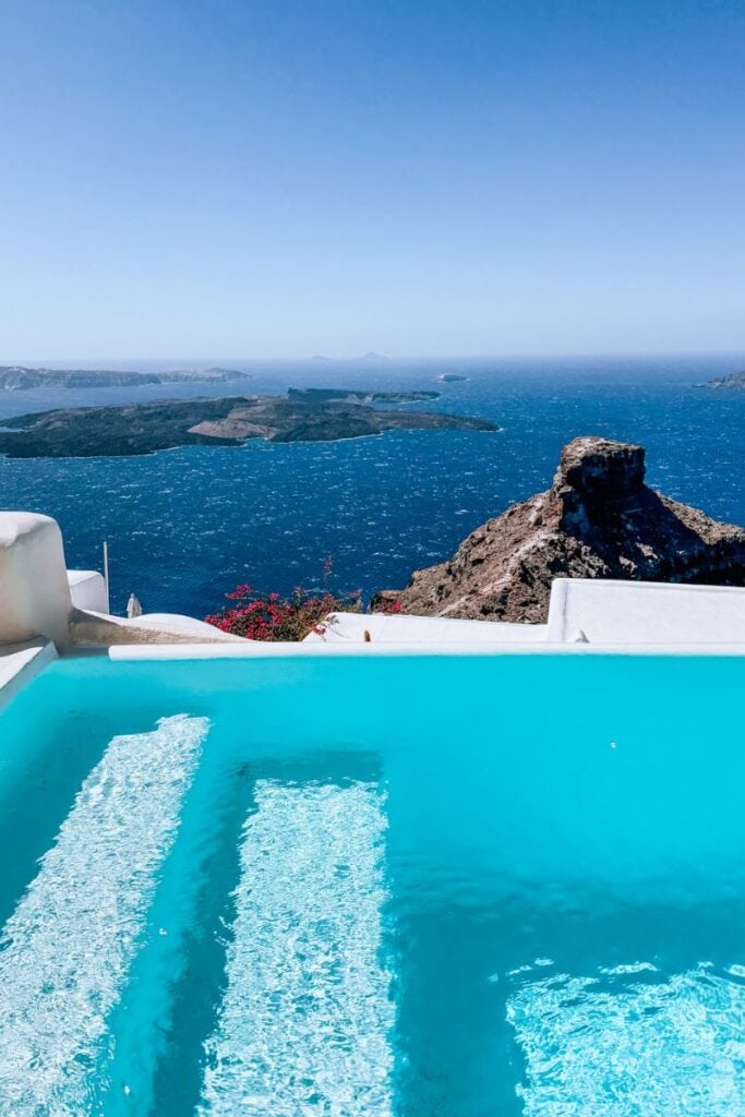 Scenic ocean view of Santorini, Greece from a luxurious poolside scene, perfect for romantic getaways.