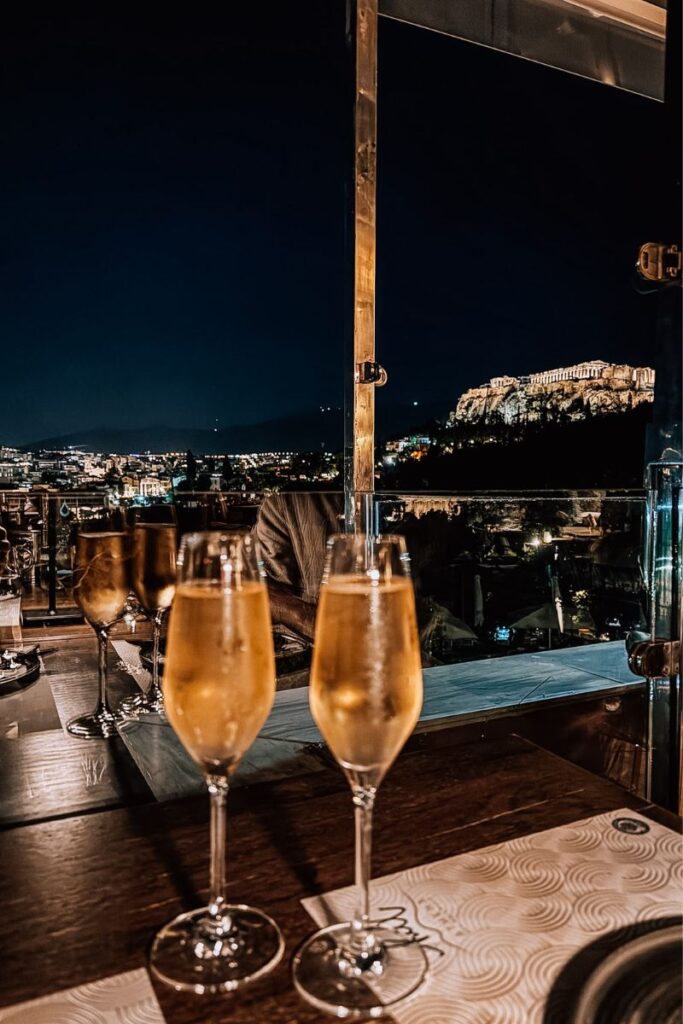 Beautiful night view of Athens skyline with illuminated Acropolis in the background.