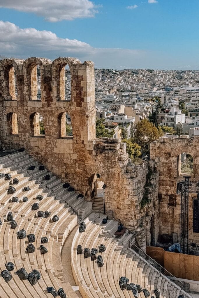 Ancient Greek Theatre ruins with panoramic city views in Athens, Greece.