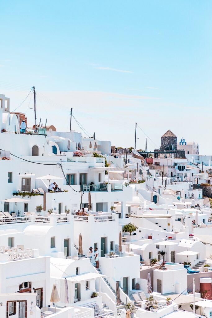 White-washed Greek island architecture with blue accents in Santorini, Greece, perfect for travel an.