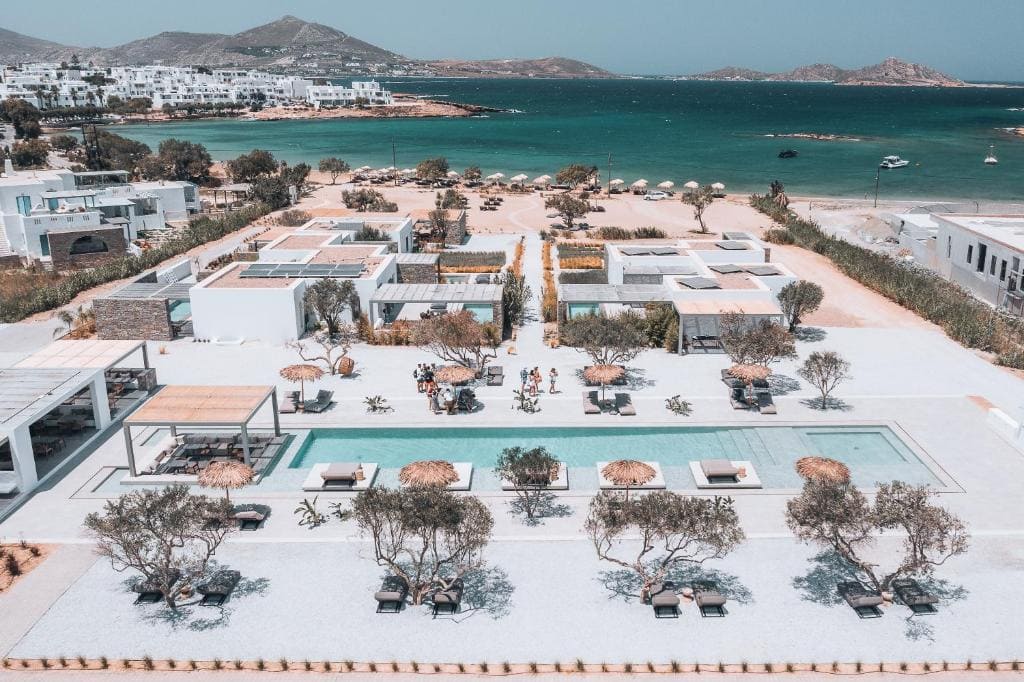 Modern hotel with pool overlooking the sea in Paros, Greece.